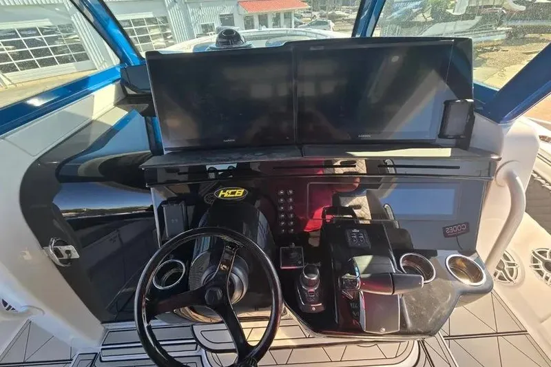 Slide: The Image of Helm of 2025 HCB 48 Campeon with dual screens and modern controls. - 14