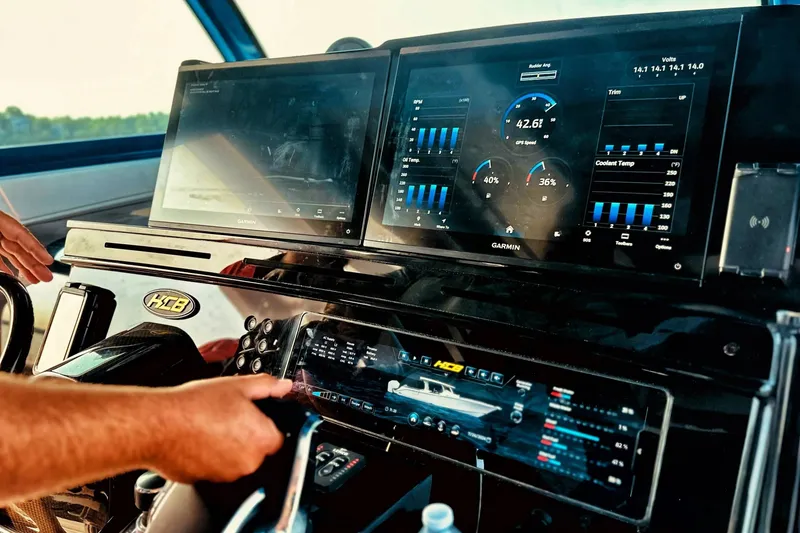 Slide: The Image of Dashboard of 2025 HCB 48 Campeon boat with advanced navigation displays. - 15