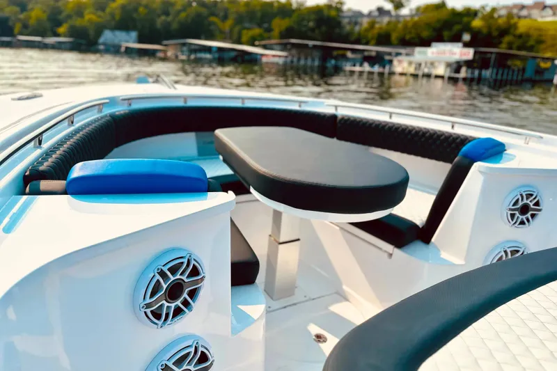 Slide: The Image of Luxury seating area on 2025 HCB 48 Campeon boat, featuring sleek design and modern amenities. - 7