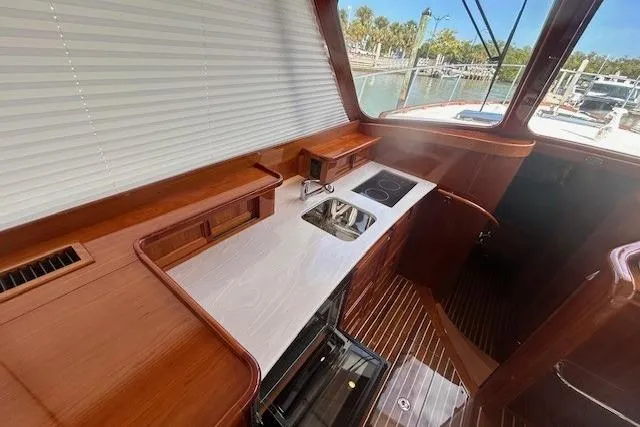Slide: The Image of Luxurious 2024 Hinckley Talaria 43 MY yacht interior with sleek kitchen design. - 4