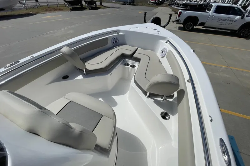 Slide: The Image of 2026 Key West 203 FS boat interior with cushioned seating and cup holders. - 10