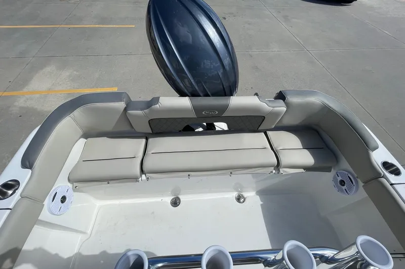 Slide: The Image of 2026 Key West 203 FS boat interior with cushioned seating and cup holders. - 12