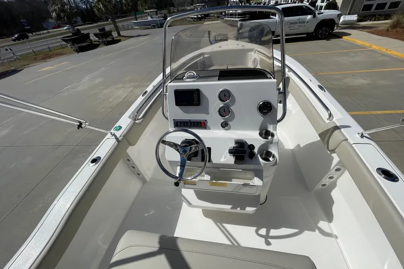Slide: The Image of 2026 Key West 203 FS boat interior with steering console and gauges. - 8