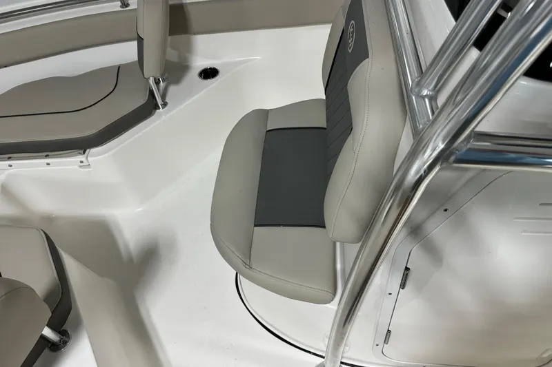 Slide: The Image of Interior of 2026 Key West 203 FS boat with gray seating and stainless steel details. - 10