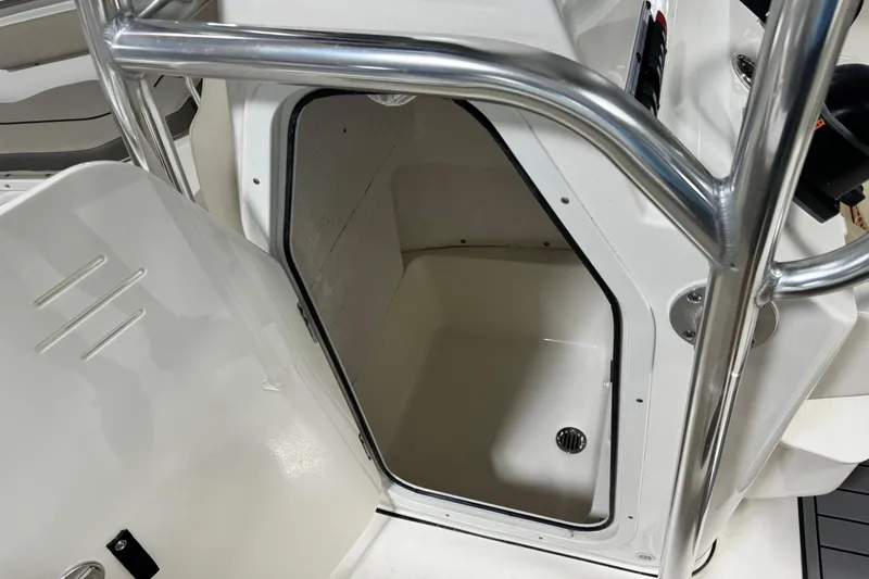 Slide: The Image of 2026 Key West 203 FS boat storage compartment with stainless steel railing. - 13