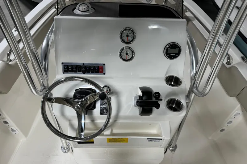 Slide: The Image of 2026 Key West 203 FS boat console with steering wheel, gauges, and controls. - 15