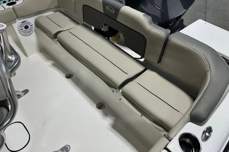 Slide: The Image of 2026 Key West 203 FS boat interior with cushioned seating and speaker. - 16