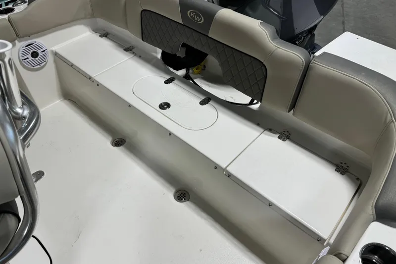 Slide: The Image of 2026 Key West 203 FS boat interior with cushioned seating and storage compartments. - 17