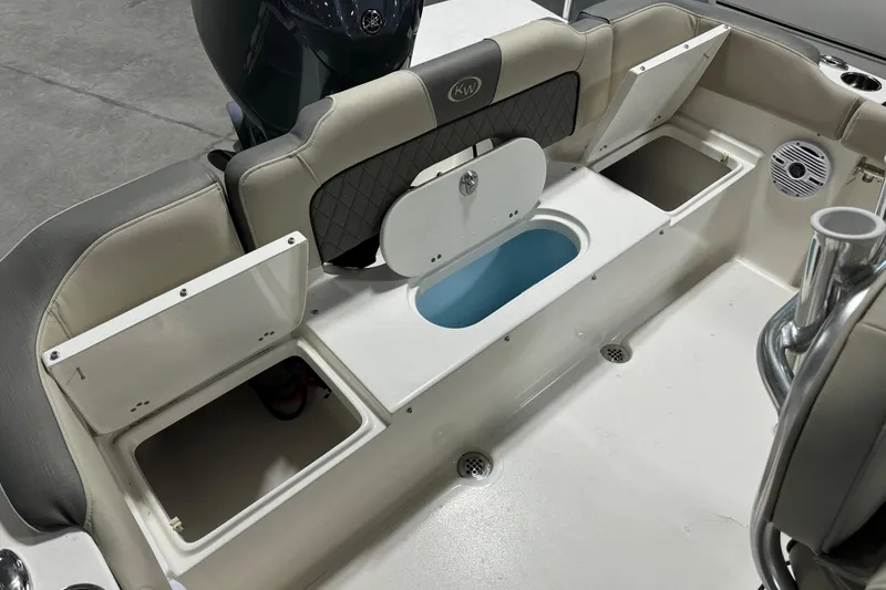 Slide: The Image of 2026 Key West 203 FS boat interior with storage compartments and seating. - 18