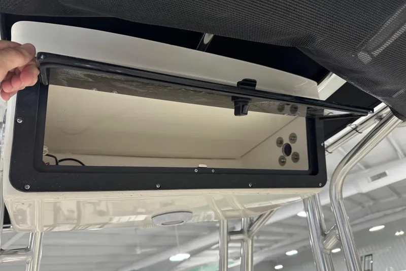 Slide: The Image of Open storage compartment on 2026 Key West 203 FS boat, showcasing interior space. - 19