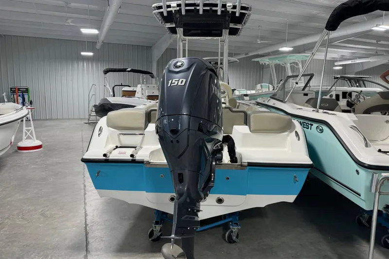 Slide: The Image of 2026 Key West 203 FS boat with Yamaha 150 engine in showroom. - 4