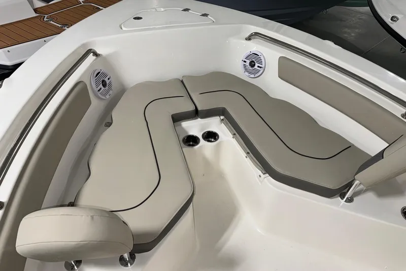 Slide: The Image of 2026 Key West 203 FS boat interior with cushioned seating and built-in speakers. - 5