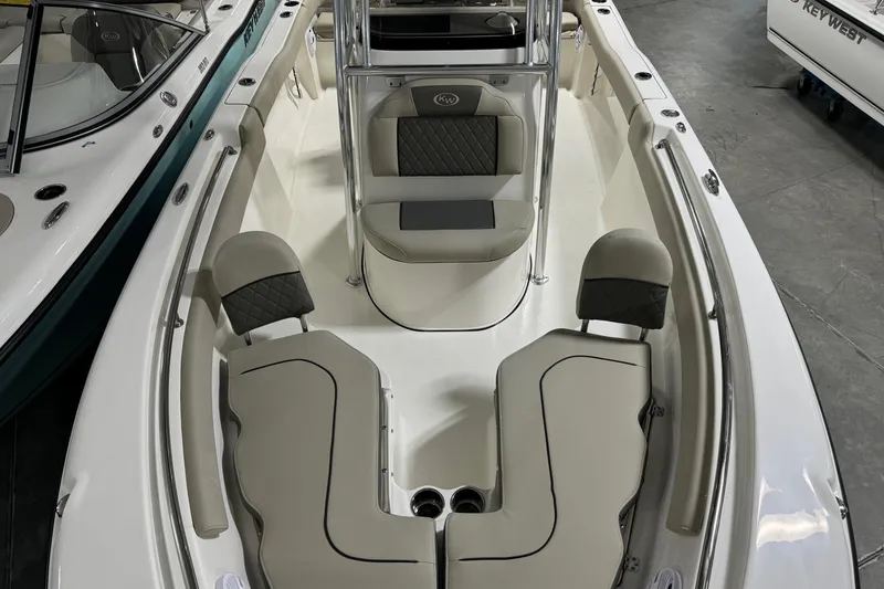 Slide: The Image of 2026 Key West 203 FS boat interior with cushioned seating and sleek design. - 9