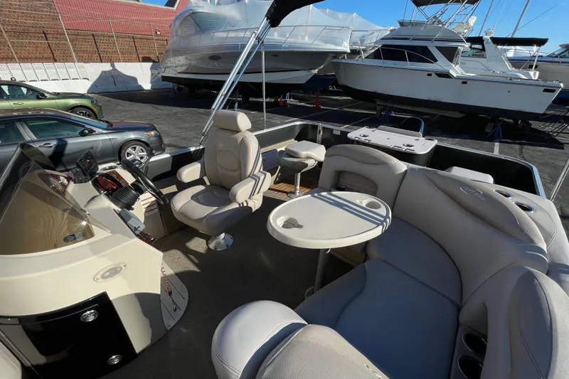 Slide: The Image of 2013 Sylvan Mirage Cruise 8520 CR pontoon boat interior with seating and helm. - 3