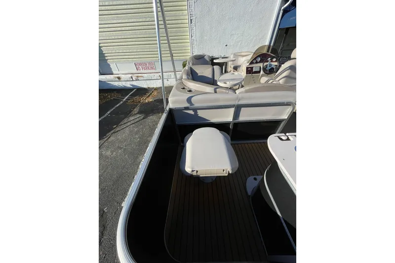 Slide: The Image of 2013 Sylvan Mirage Cruise 8520 CR pontoon boat interior with seating and steering console. - 5