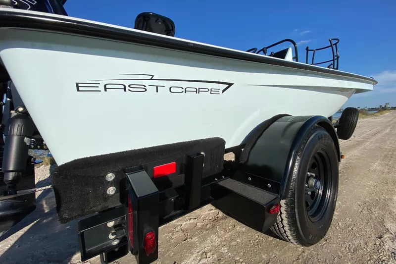 Slide: The Image of 2024 East Cape EVO 18V boat on trailer, side view with logo visible. - 16