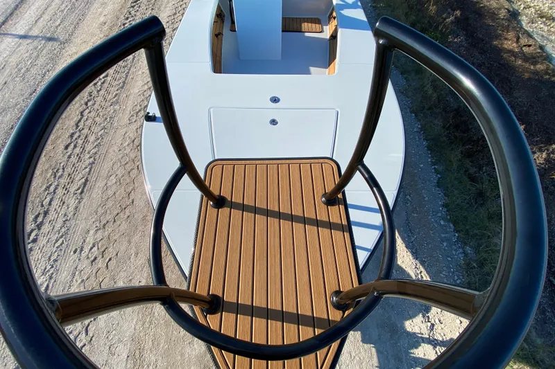 Slide: The Image of 2024 East Cape EVO 18V boat with elevated platform and sleek design. - 23