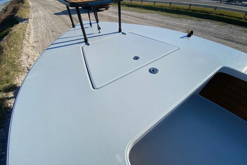 Slide: The Image of 2024 East Cape EVO 18V boat deck, showcasing sleek design and storage features. - 25