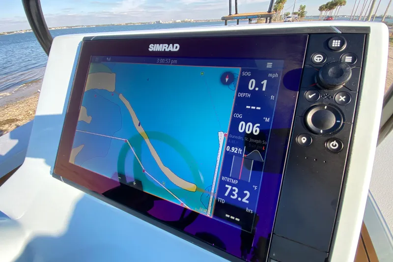 Slide: The Image of Simrad navigation display on 2024 East Cape EVO 18V boat, showing map and data. - 39