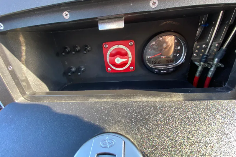 Slide: The Image of 2024 East Cape EVO 18V dashboard with switches, gauge, and control panel. - 44