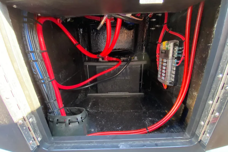 Slide: The Image of 2024 East Cape EVO 18V electrical compartment with red and blue wiring. - 45