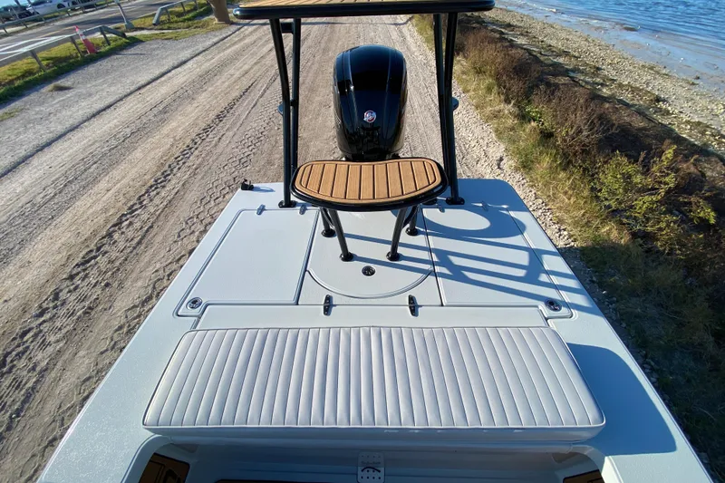 Slide: The Image of 2024 East Cape EVO 18V boat on a dirt road near the shoreline. - 47