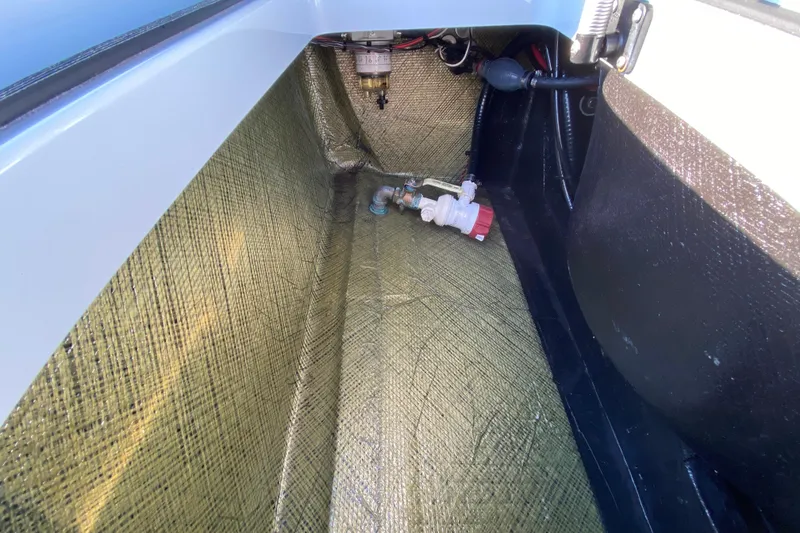 Slide: The Image of 2024 East Cape EVO 18V boat interior showing fuel system components and wiring. - 53