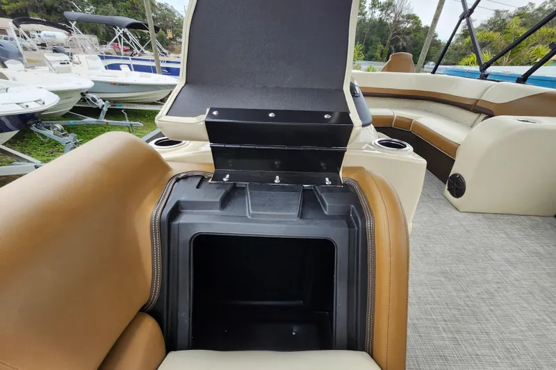 Slide: The Image of 2026 Lowe SF 212 Sport Fish boat interior with open storage compartment and seating. - 14