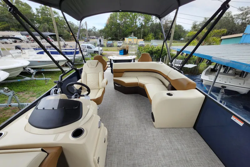 Slide: The Image of 2026 Lowe SF 212 Sport Fish pontoon boat with spacious seating and modern helm. - 15