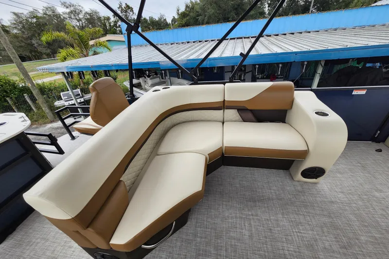 Slide: The Image of 2026 Lowe SF 212 Sport Fish boat interior with beige and brown seating. - 16