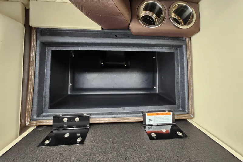 Slide: The Image of Interior storage compartment of 2026 Lowe SF 212 Sport Fish boat with cup holders. - 17