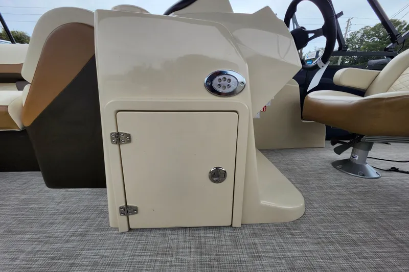 Slide: The Image of 2026 Lowe SF 212 Sport Fish boat interior with beige seating and storage compartment. - 21