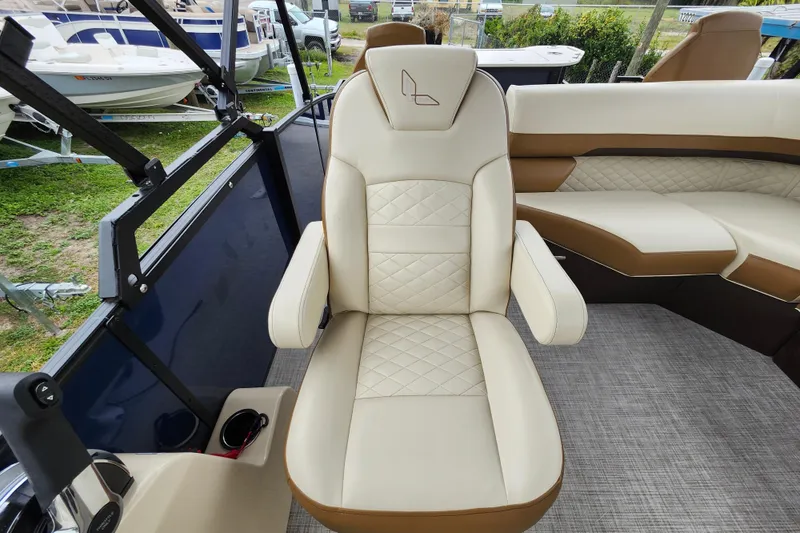 Slide: The Image of Luxurious seating on 2026 Lowe SF 212 Sport Fish boat, featuring beige and brown upholstery. - 23