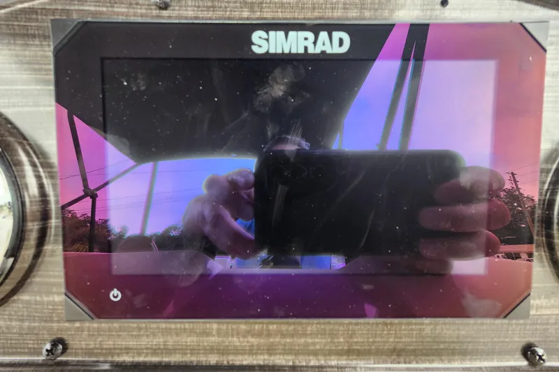 Slide: The Image of Simrad display on 2026 Lowe SF 212 Sport Fish boat dashboard. - 27