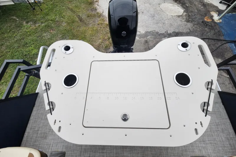 Slide: The Image of 2026 Lowe SF 212 Sport Fish boat deck with rod holders and measurement markings. - 29