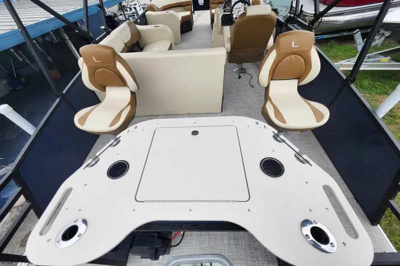 Slide: The Image of 2026 Lowe SF 212 Sport Fish boat interior with beige seating and fishing deck. - 31