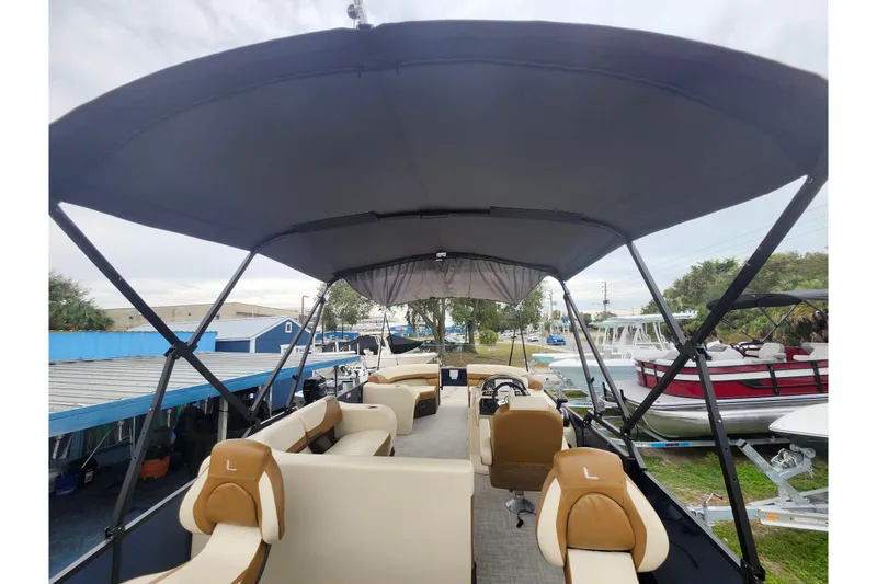 Slide: The Image of 2026 Lowe SF 212 Sport Fish pontoon boat with spacious seating and canopy. - 32