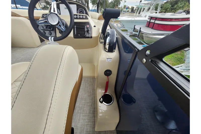 Slide: The Image of Interior view of 2026 Lowe SF 212 Sport Fish boat, featuring steering wheel and control panel. - 35