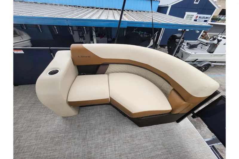 Slide: The Image of Luxurious seating on 2026 Lowe SF 212 Sport Fish boat, featuring beige and brown upholstery. - 36