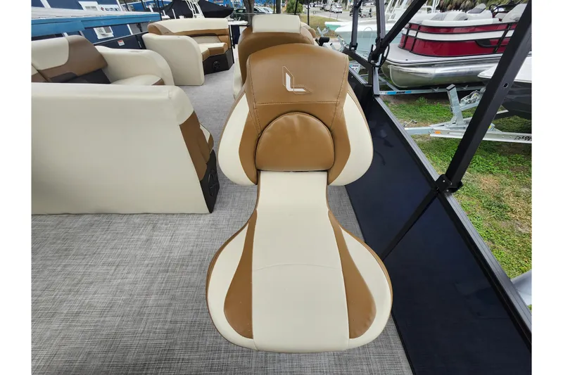 Slide: The Image of 2026 Lowe SF 212 Sport Fish boat interior with tan and white seating. - 39