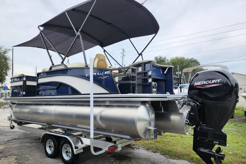 Slide: The Image of 2026 Lowe SF 212 Sport Fish pontoon boat with Mercury outboard motor and canopy. - 4
