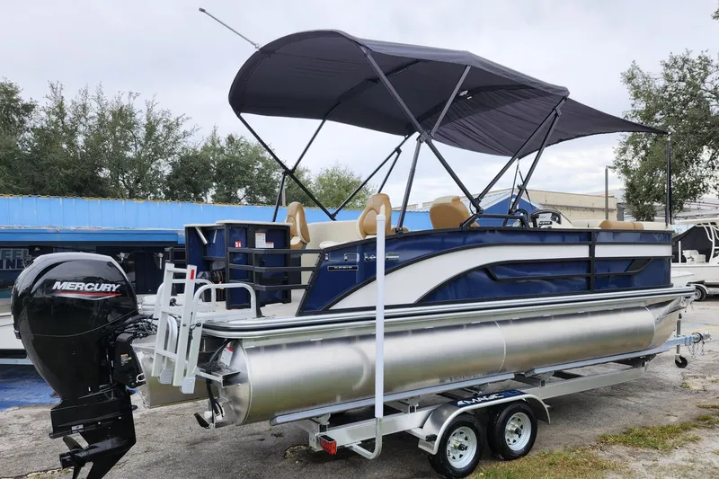 Slide: The Image of 2026 Lowe SF 212 Sport Fish pontoon boat with canopy and Mercury outboard motor. - 6