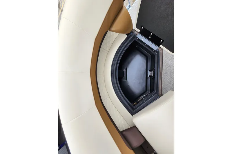 Slide: The Image of 2026 Lowe SF 212 Sport Fish boat interior storage compartment with cushioned seating. - 9
