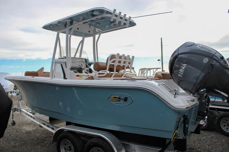 The Image of 2026 Sea Hunt Ultra 219 boat with Yamaha engine on trailer, side view. - 0