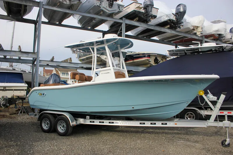 Slide: The Image of 2026 Sea Hunt Ultra 219 boat on trailer in marina storage. - 1