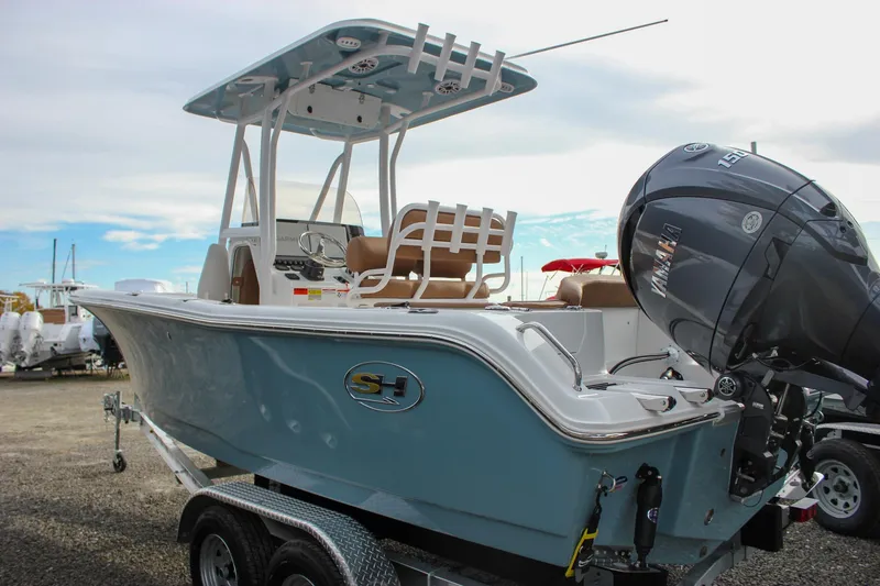 Slide: The Image of 2026 Sea Hunt Ultra 219 boat with Yamaha outboard engine on trailer. - 12