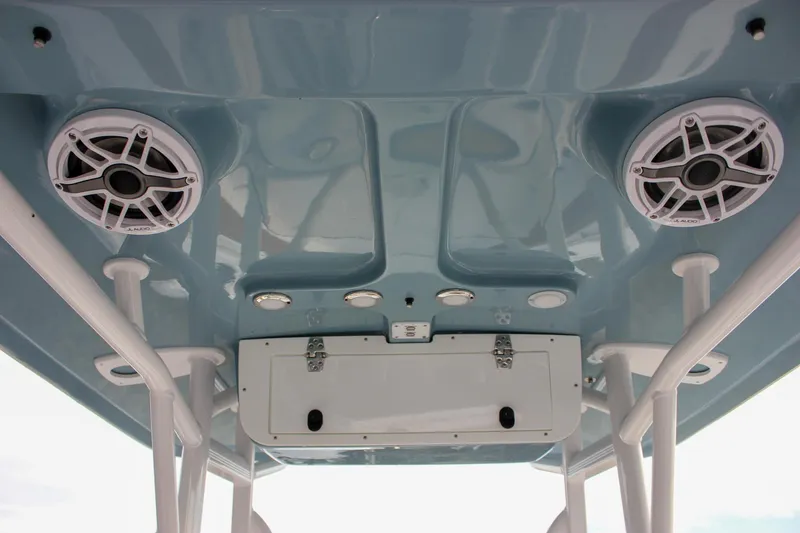 Slide: The Image of 2026 Sea Hunt Ultra 219 boat ceiling with speakers and storage compartment. - 16