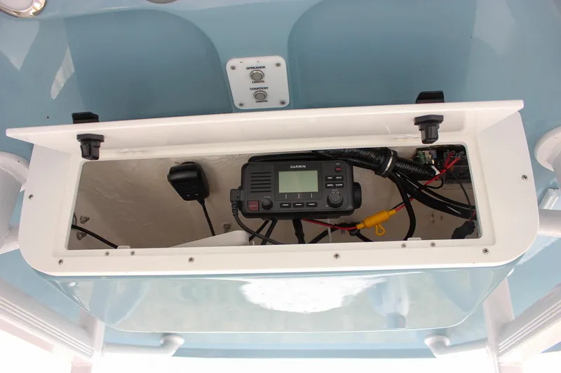 Slide: The Image of 2026 Sea Hunt Ultra 219 boat console with Garmin marine radio and wiring. - 20