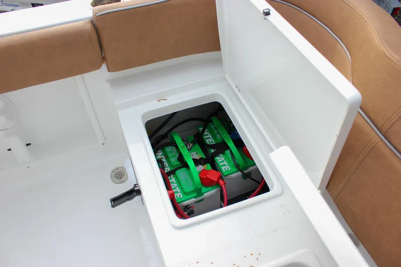 Slide: The Image of Battery compartment of 2026 Sea Hunt Ultra 219 boat with Interstate batteries. - 28