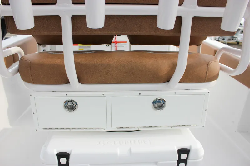 Slide: The Image of 2026 Sea Hunt Ultra 219 boat seat with storage drawers and cooler. - 31